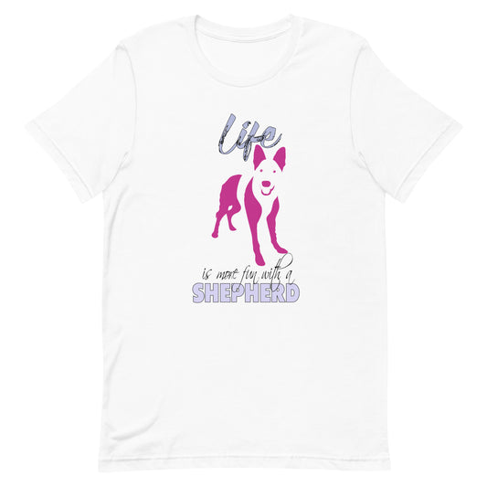 White cotton crew neck unisex  short sleeve tshirt, on the apparel is a graphic print silhouette of a cute adorable Shepherd standing , the dog silhouette is in pink color, above the dog is the text " Life" written in tilted purple graphic letter, below is the text " is more fun with a Shepherd" in capital letter, the text "Shepherd" stands out with its pink color