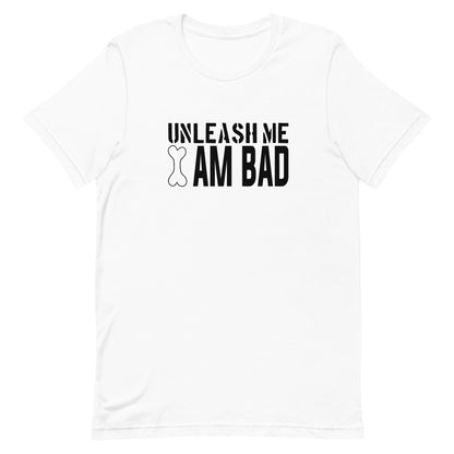 White cotton crew neck unisex  short sleeve tshirt, on the apparel is a graphic black text  saying "unleash me i am bad" .   the  letter "I" is a graphic shaped dog bone