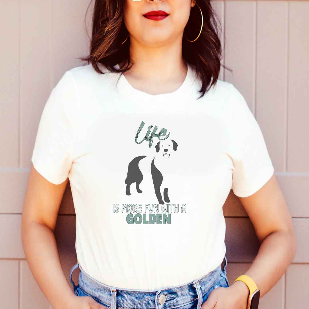  White cotton crew neck unisex  short sleeve tshirt, on the apparel is a black one-line graphic print silhouette of a cute Golden Retriever standing with its tongue out. Above the dog is the text " LIFE" in cap and underneath the dog is the text " is more fun with a Golden" in cap"