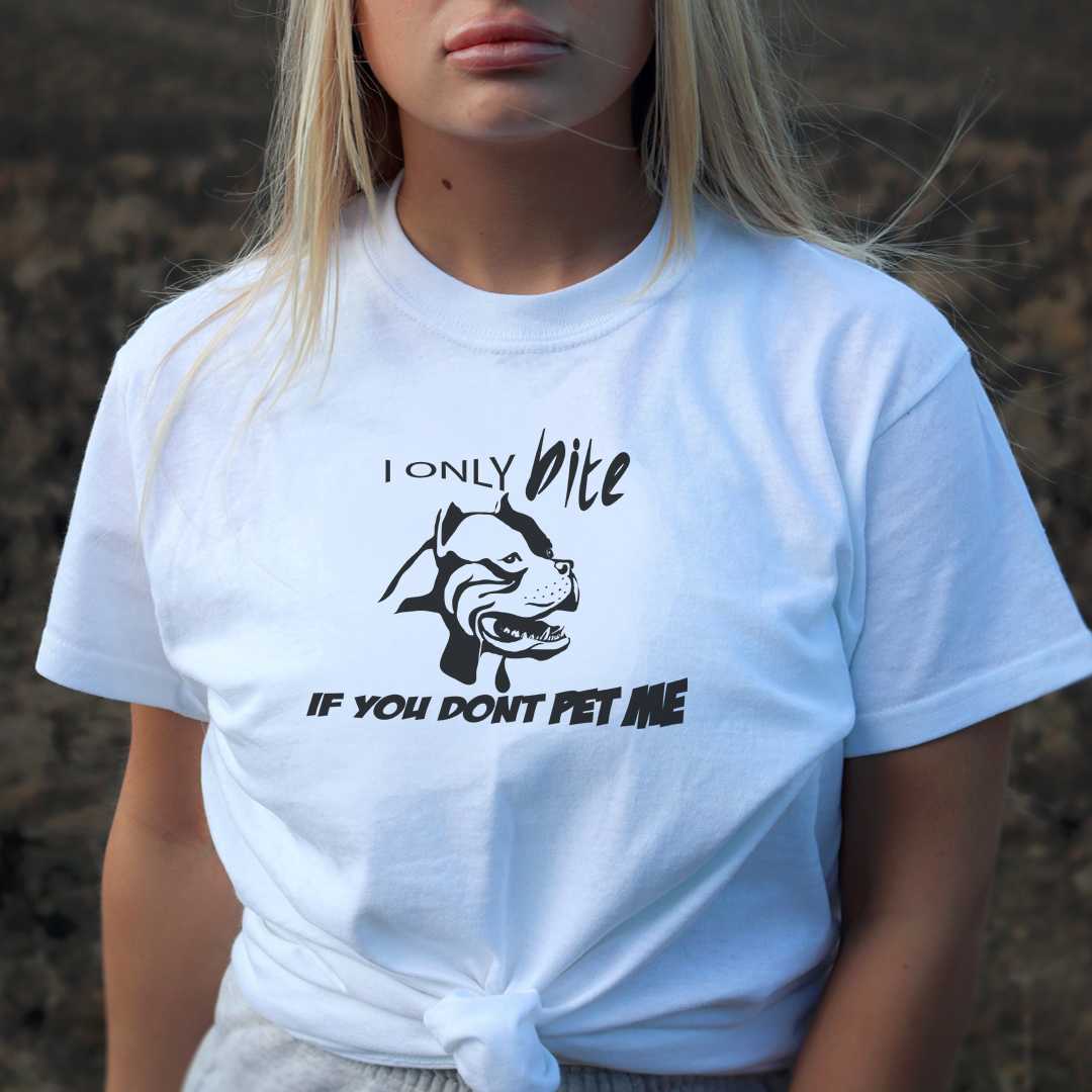 White cotton crew neck unisex  short sleeve tshirt, on the apparel is a black /white graphic rottweilers face  showing short mouth aggression above the dog is the text "i only bite" and below the dog is the text "if you don't pet me"